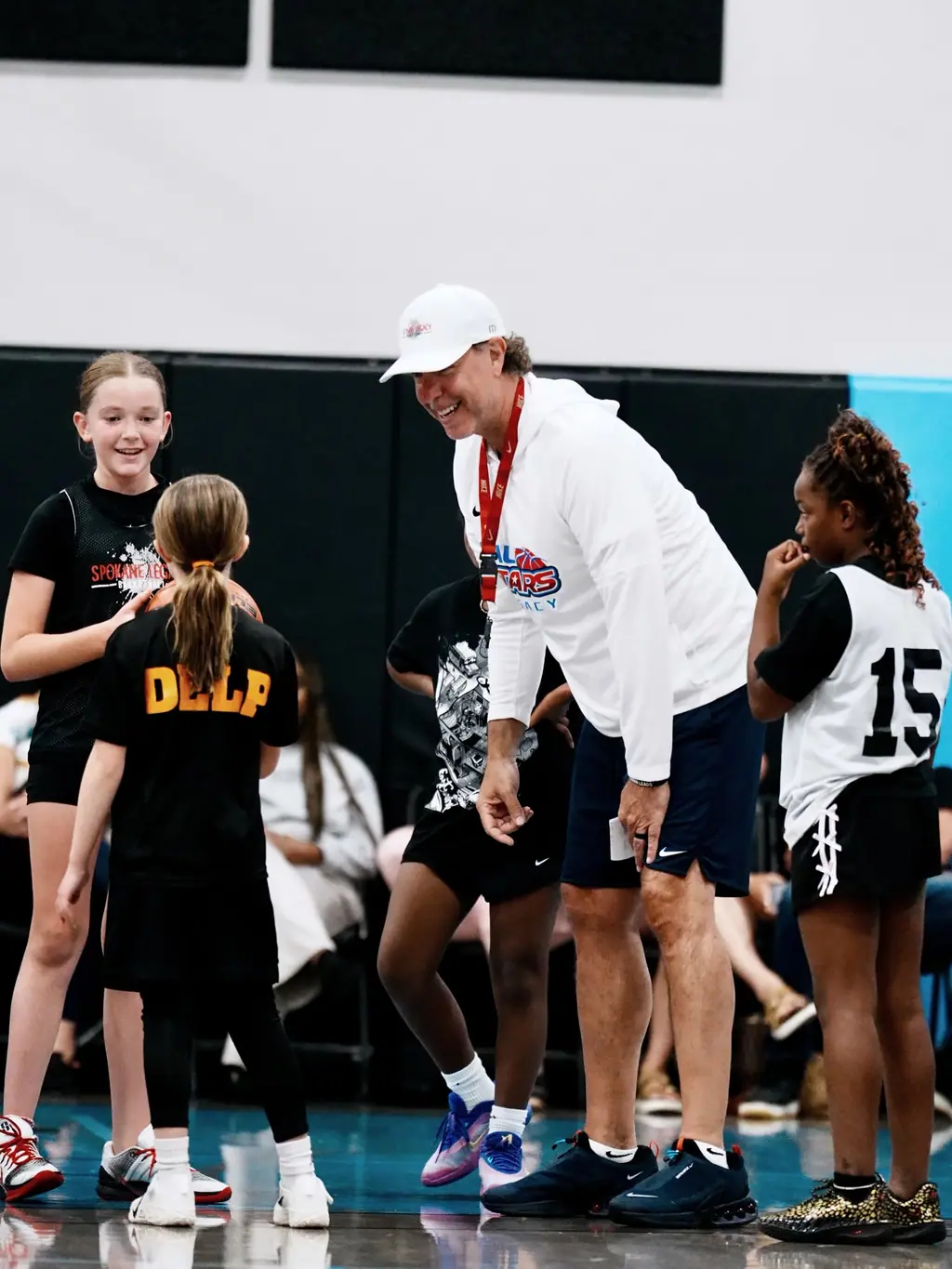 Coach leaning in with a group