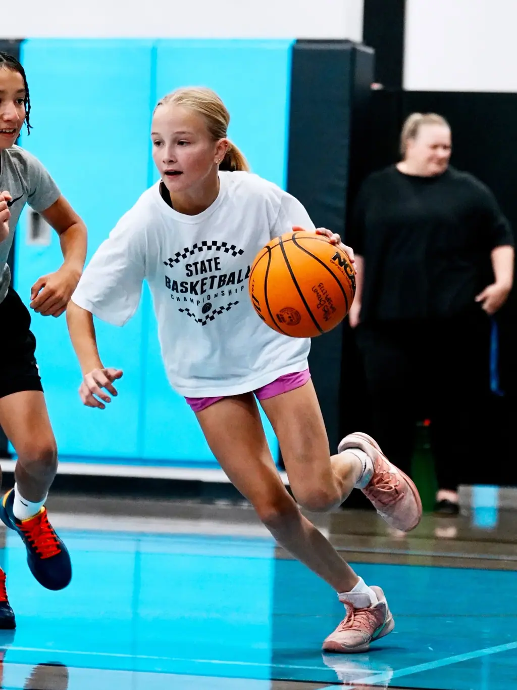 Young player dribbling in the gym