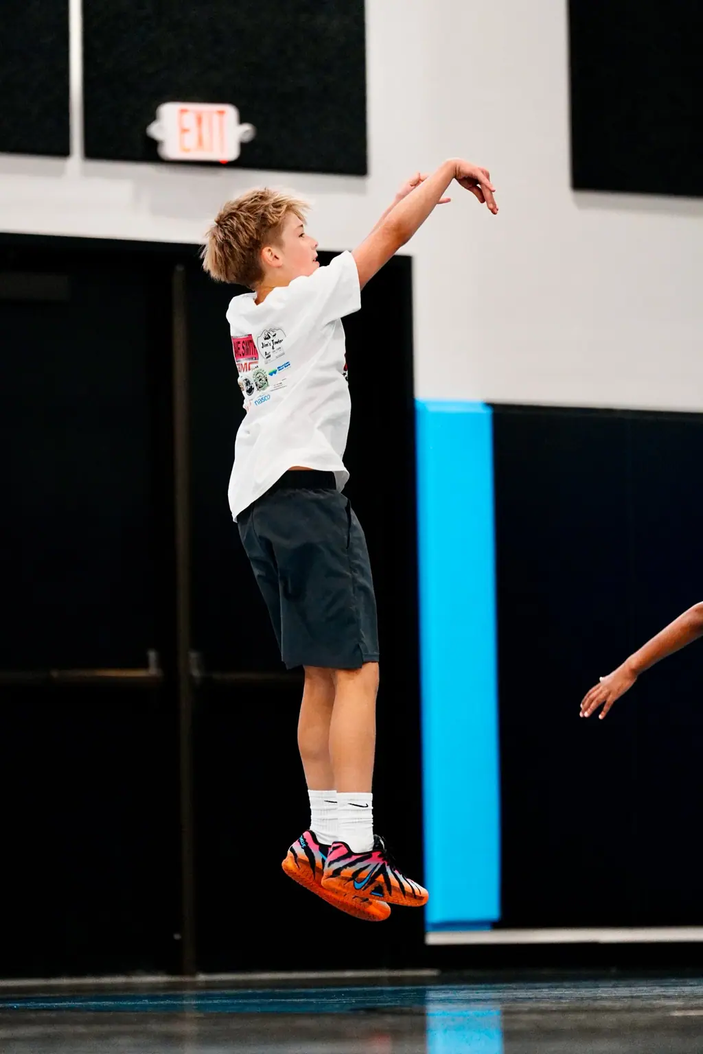 Player following through on a jump shot