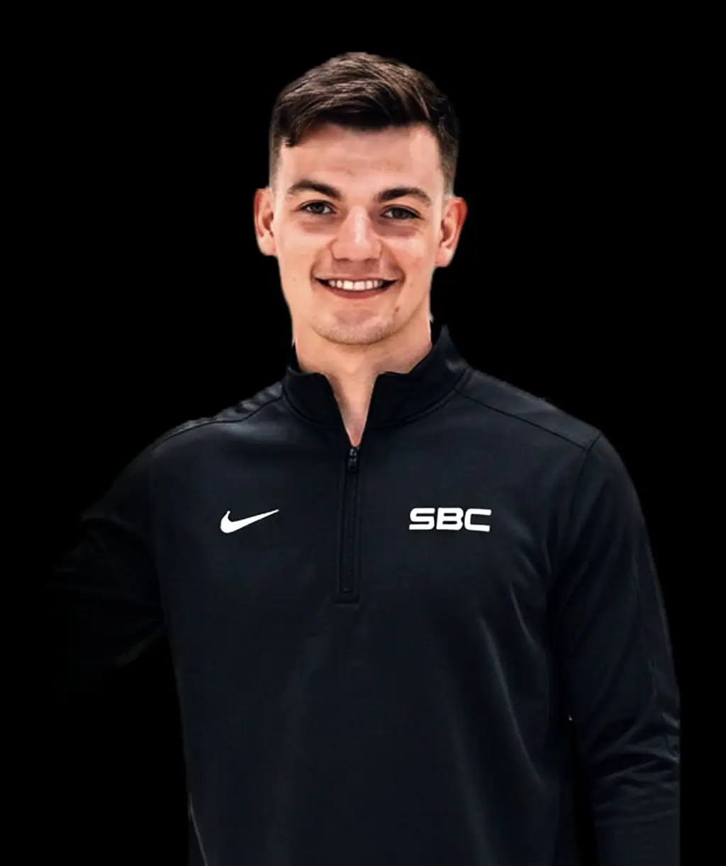 SBC coach portrait on a dark background