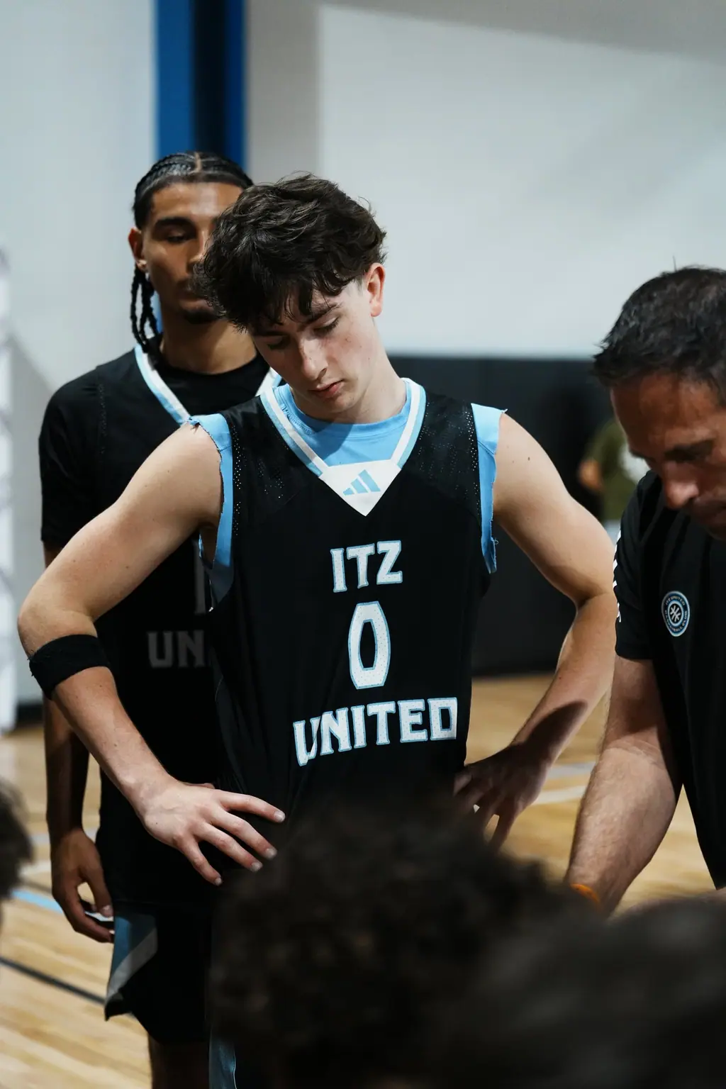 Player with teammates on the sideline