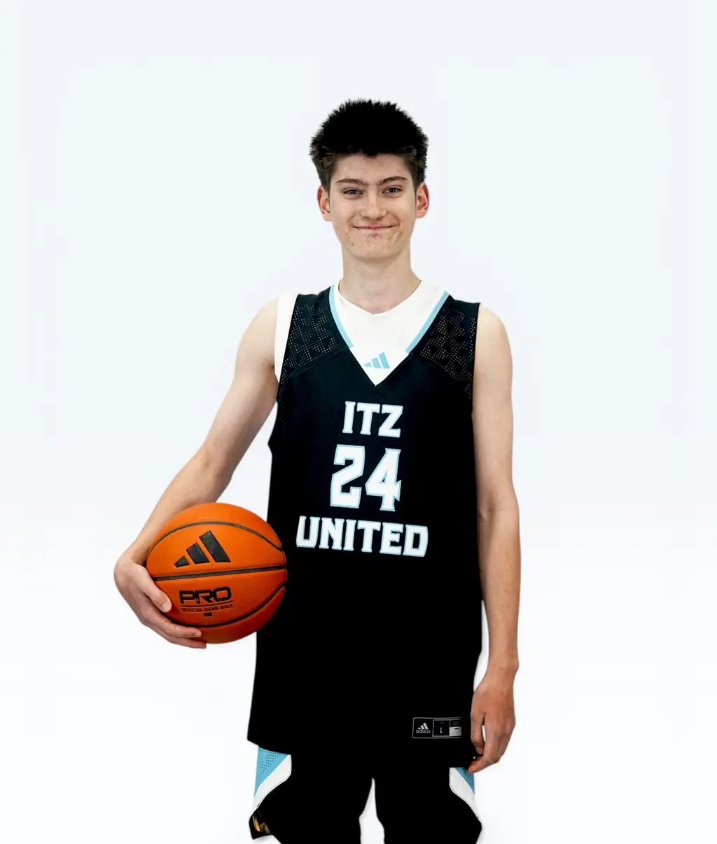 Smiling player holding a ball, jersey 24