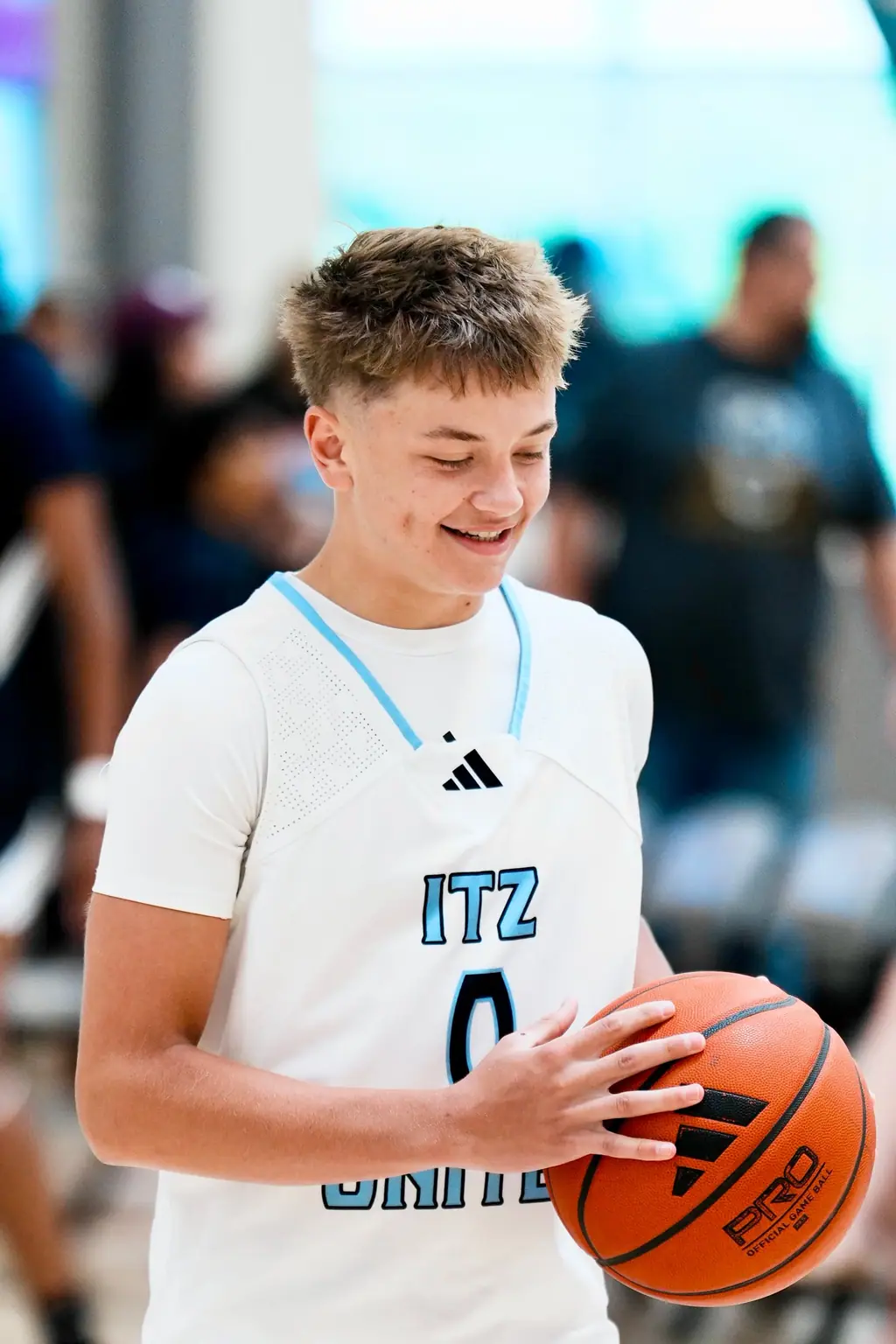 Smiling player with a basketball